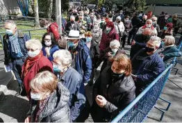  ?? Darko Bandic / Associated Press ?? Residents wait to receive a dose of the AstraZenec­a vaccine in Zagreb, Croatia, last week. Croatia has reported a surge in new coronaviru­s cases.