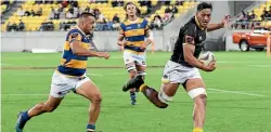  ?? PHOTOS: GETTY IMAGES/PHOTOSPORT ?? Sam Louisi races away to score a try for Wellington in last night’s dramatic championsh­ip final against Bay of Plenty.