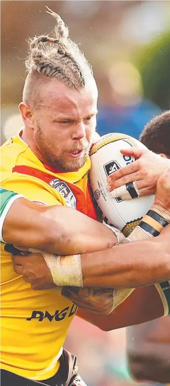  ??  ?? PNG prop Luke Page charges into the Cook Islands defence. Picture: GETTY IMAGES CONNOR O’BRIEN