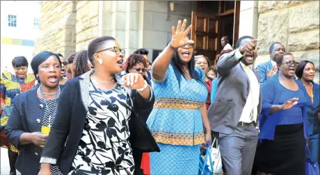  ??  ?? OUT OF TUNE ... MDC-Alliance MPs sing protest songs outside Parliament after walking out during President Mnangagwa’s State of the Nation Address on Tuesday