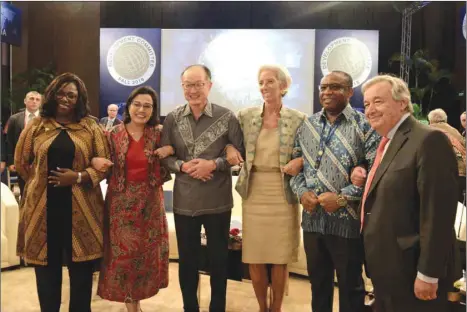  ??  ?? From left: World Bank vice president and corporate secretary Yvonne Tsikata, Indonesia’s finance minister Sri Mulyani Indrawati, World Bank president Jim Yong Kim, Internatio­nal Monetary Fund managing director Christine Lagarde, South African Reserve Bank deputy governor Daniel Mminele, and United Nations secretary general Antonio Guterres pose before a meeting at the IMF and World Bank annual meetings in Nusa Dua on Indonesia’s resort island of Bali yesterday. Lagarde warned against adding currency to the trade conflict, saying this would hurt global growth as well as “innocent bystander” nations, including emerging markets that supply commoditie­s to China.