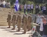  ?? (Gush Etzion Regional Council) ?? PEOPLE STAND silently at Wednesday’s annual Remembranc­e Day ceremony at the Kfar Etzion cemetery in Gush Etzion.