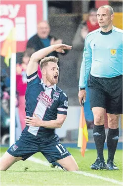  ?? Picture: SNS. ?? Ross County’s Jonathan Franks celebrates his late winner.