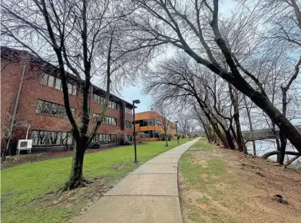  ?? JORDAN SMITH/SOUTH BEND TRIBUNE ?? The city of South Bend bought three buildings that formerly made up the River Glen Office Park, on the west bank of the St. Joseph River near the post office in downtown South Bend.