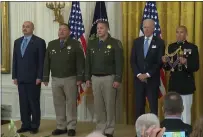  ?? COURTESY OF THE WHITE HOUSE ?? Former California Highway Patrol Officer Robert Paul III, left, and current officers Vincent Mendoza and Ryan Smith stand next to President Joe Biden, who presented them Monday with Medals of Valor at the White House for their roles in a Riverside gunbattle with a motorist in 2019 in which Paul and Smith were wounded.