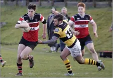  ??  ?? Wicklow’s Tim Spencer chased by Liam McGovern.