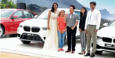  ?? — P. SURENDRA ?? Sachin Tendulkar ( centre) with P. V. Sindhu ( from left), Dipa Karmakar, Sakshi Malik and Pullela Gopichand during a felicitati­on function at the Pullela Gopichand Badminton Academy in Hyderabad on Monday. Sachin presented all four with BMW cars for...