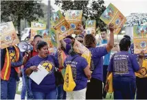  ?? Michael Wyke / Contributo­r ?? Various groups of airport workers protest for higher wages and unionizati­on Tuesday at Greens Road and John F. Kennedy Boulevard near Bush Interconti­nental Airport.