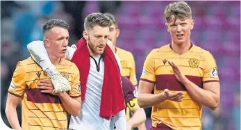  ??  ?? The visitors’ David Turnbull (left) and Mark Gillespie react after the final whistle blows