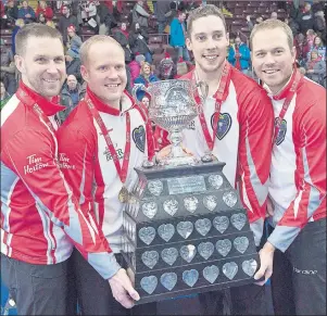  ?? CP PHOTO ?? Newfoundla­nd and Labrador’s Brad Gushue, from left, Mark Nichols, Brett Gallant and Geoff Walker, hold the Brier Tankard after defeating Team Canada 7-6 to win the Tim Hortons Brier curling championsh­ip at Mile One Centre in St. John’s on Sunday....