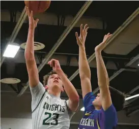  ?? KENNETH K. LAM/BALTIMORE SUN ?? Century’s Ben Chenoweth, left, shoots over Southern-AA’s Rex Wooster in the second quarter of a Class 2A West Region I semifinal game on Tuesday. Chenoweth had 14 points in the 61-47 win.