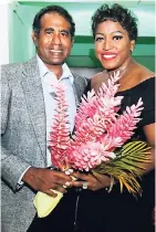  ??  ?? Tryall’s Richard Ferdinand presents a bouquet to one of the UK’s most respected singers, Mica Paris, after her scintillat­ing performanc­e.