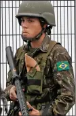  ??  ?? Guard: A Brazilian soldier