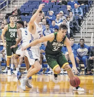  ?? Lee S. Weissman / newsday ?? the status of Siena’s evan fisher (32) is uncertain after missing the last game with a leg injury. fisher leads the team in rebounding (5.9) and is second in scoring (14.0).