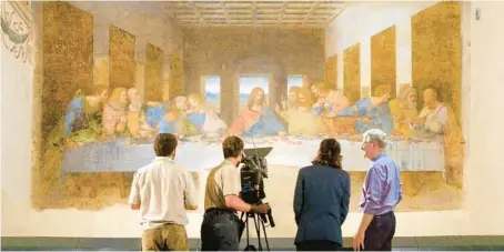  ?? RICK STEVES’ EUROPE PHOTOS ?? Rick Steves and crew with Leonardo da Vinci’s “The Last Supper” at the Church of Santa Maria delle Grazie in Milan.