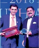  ?? ?? Commercial Bank Chief Operating Officer S. Renganatha­n (right) receiving the award