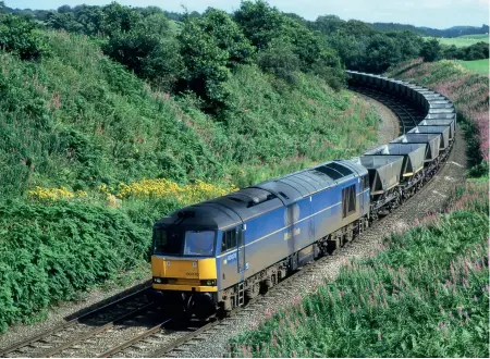  ??  ?? LEFT:
By 1998 EWS had abolished any rigidity in loco pools and made just about all of them common user. Former Mainline Freight 60078 in the company’s striking Aircraft Blue livery, allegedly the most expensive paint put on a loco, is seen crossing the Tyne Valley route on August 15, 1998. It is in Cowran Cutting between Brampton Fell and Wetheral with the 6Z83
1043 Tyne Yard to Ayr Falkland Yard empties.
(All photos Douglas Johnson)