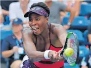  ?? [FRANK FRANKLIN II/THE ASSOCIATED PRESS] ?? Venus Williams returns the ball to Camila Giorgi during the second round of the U.S. Open, Wednesday in New York.