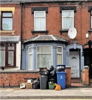  ??  ?? THAT’S JUST RUBBISH: The bins outside the house in Campbell Road, Stoke.