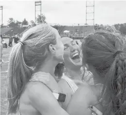  ?? MARKMIRKO/HARTFORD COURANT ?? Tolland 3,200-meter relay teammates Lillian Byam (left to right), Peyton Bornstein, Isabelle McNamee (not pictured) and Calista Mayer celebrate their win after recording a time of 10:24.69.