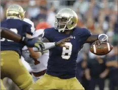  ??  ?? In this Sept. 5, 2015, file photo, Notre Dame quarterbac­k Malik Zaire looks to a pass during the first half of an NCAA college football game against Texas, in South Bend, Ind. AP PHOTO