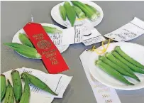  ?? [PHOTOS BY JIM BECKEL, THE OKLAHOMAN] ?? Okra entries on a table after judging was completed on the final day of the Oklahoma County Free Fair in the Centennial Building at State Fair Park on Aug. 26.