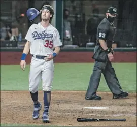  ??  ?? CODY BELLINGER, the potential tying run, crosses the plate but too late, after AJ Pollock grounded out to end Game 2. Down f ive, L. A. scored four in the ninth.