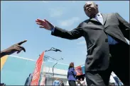  ?? LUIS SINCO/LOS ANGELES TIMES FILE PHOTOGRAPH ?? U.S. Rep. and civil rights pioneer John Lewis is greeted by a member of the audience during a rally against child poverty on April 9 in South Los Angeles.