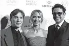  ?? AFP VIA GETTY IMAGES ?? From left, Cillian Murphy, Emily Blunt and Robert Downey Jr. arrive for the 35th Annual Producers Guild Awards on Sunday.