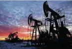  ?? Andrey Rudakov / Bloomberg ?? Oil pumping jacks operate near Neftekamsk, in the Republic of Bashkortos­tan, Russia. Oil prices are near $50 a barrel.