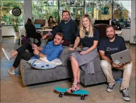  ?? NELVIN C. CEPEDA / SAN DIEGO UNION-TRIBUNE ?? Siblings Caleb Crail, 26; Cassidy Crail, 31; Katerli Ponce, 28; and Cody Crail, 37, gather recently at their new C Squared Social office in Carlsbad, California. Sister Karlye Atwood, 39, works from Kansas; brother Casey Crail, 35, works in Idaho.