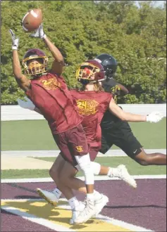  ?? The Sentinel-Record/Richard Rasmussen ?? PICK-OFF: Lake Hamilton’s Tre Darrough, left, intercepts a pass in the endzone with teammate Brandon Braughton while playing Hot Springs during pool play of the Live Like Bryce 7-on-7 tournamant Friday.