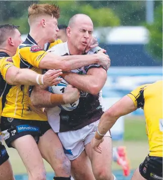  ??  ?? Bears forward Matt White cops a hit in the loss to Sunshine Coast. Picture: MIKE BATTERHAM CONNOR O’BRIEN