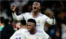 ?? Photograph: Soccrates Images/Getty Images ?? Eduardo Camavinga gets a lift from Vinícius Júnior as Real Madrid celebrate their Champions League comeback against Chelsea.