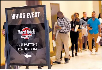  ?? AP ?? People attend a June job fair in Hollywood, Fla. The number of U.S. job openings was unchanged in June.