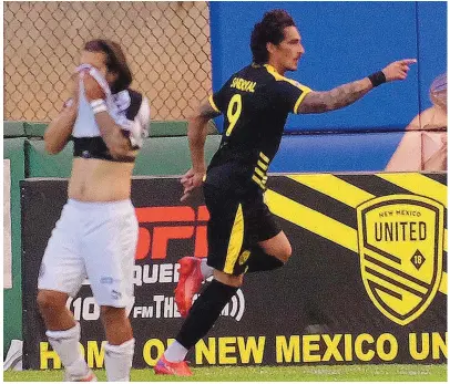  ?? ADOLPHE PIERRE-LOUIS/JOURNAL ?? New Mexico United’s Davon Sandoval, right, celebrates his goal in the opening minutes of the game against Oakland Roots SC at Isotopes Park on Wednesday night.