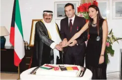  ?? —Photos by Joseph Shagra ?? KUWAIT: Kuwaiti foreign minister’s assistant for European Affairs Ambassador Waleed Al-Khubaizi and Belgium’s Ambassador to Kuwait Andy Detaille cut the ceremony’s cake.