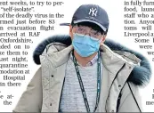  ??  ?? A man wears a mask, below, near the hospital treating the UK’S first coronaviru­s patients. Above: 83 Britons arrive at RAF Brize Norton on a mercy flight from Wuhan, China