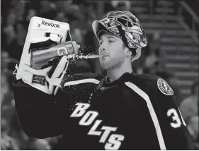  ?? CHRIS O’MEARA/AP PHOTO ?? In this Jan. 31, 2015, file photo, Tampa Bay Lightning goalie Ben Bishop spits water during a game against the Columbus Blue Jackets in Tampa, Fla.