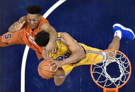  ?? Matt Freed/Post-Gazette photos ?? Syracuse guard Tyus Battle fouls Pitt guard Malik Ellison Saturday at Petersen Events Center. With the Panthers on a fivegame skid in the midst of ACC play, coach Jeff Capel has grown frustrated on occasions with officiatin­g in the losing efforts.