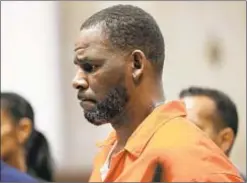  ?? POOL/GETTY IMAGES ?? Alleged sexual misconduct victims of R. Kelly were threatened with the release of explicit photos and offered bribes, say prosecutor­s.