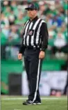  ?? BRENT JUST, GETTY IMAGES ?? Dave Foxcroft is pictured on the field as a CFL referee, and as a happy Lotto Max winner of $219,193.70.