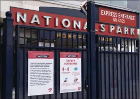  ?? JACQUELYN MARTIN - THE ASSOCIATED PRESS ?? Nationals Park is closed after the opening day baseball game between the Washington Nationals and New York Mets was postponed because of coronaviru­s concerns. Thursday, April 1, 2021, in Washington.