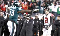  ?? Chris Szagola/Associated Press file photo ?? ■ Atlanta Falcons’ Matt Ryan and Philadelph­ia Eagles’ Nigel Bradham react after Atlanta cannot score on fourth and goal during the second half of an NFL divisional playoff football game on Jan. 8 in Philadelph­ia. The Eagles have a tough opponent Thursday night in the NFL opener. The Falcons were 2 yards away from knocking the Eagles out of the playoffs in the divisional round, but Matt Ryan’s pass to Julio Jones fell incomplete in the right corner of the end zone.