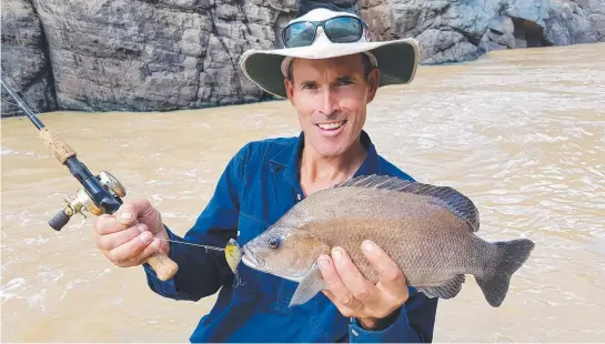  ?? FAT SOOTY: Stephen Alldridge pulled this solid grunter from fast Burdekin River waters. ??