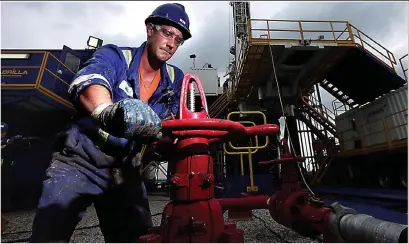  ??  ?? Turning on the tap: A worker at a Cuadrilla shale drilling operation near Preston, Lancashire