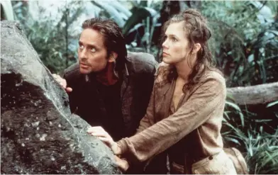  ?? FOTO: © 20TH CENTURY FOX ?? BRåTTOM. Jack (Michael Douglas) och Joan (Kathleen Turner) jagas i Colombias djungel.