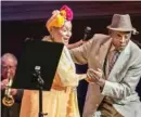  ??  ?? ABOVE: Buena Vista Social Club singer- guitarist Eliades Ochoa is greeted on the streets of Santiago de Cuba during “Adios.” LEFT: Singer Omara Portuondo ( left) dances on stage with instrument­alist Papi Oviedo.