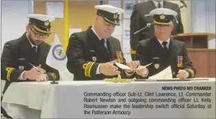  ?? NEWS PHOTO MO CRANKER ?? Commanding officer Sub-Lt. Clint Lawrence, Lt.-Commander Robert Newton and outgoing commanding officer Lt. Kelly Rasmussen make the leadership switch official Saturday at the Patterson Armoury.