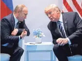  ?? EVAN VUCCI, AP ?? President Trump speaks with Russian President Vladimir Putin at the G-20 summit July 7 in Hamburg.